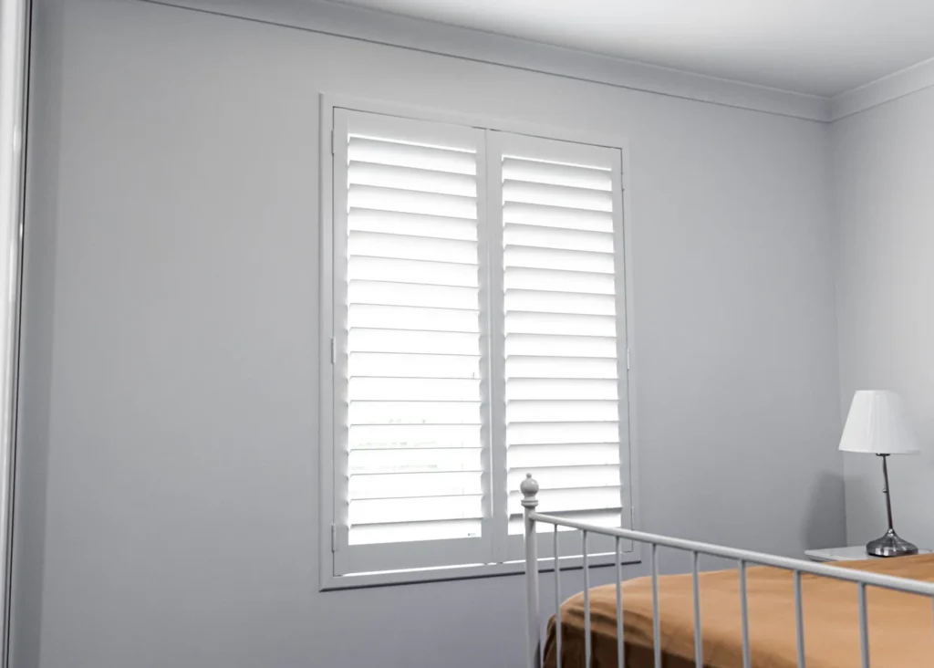 White PVC plantation shutters installed in a Perth home