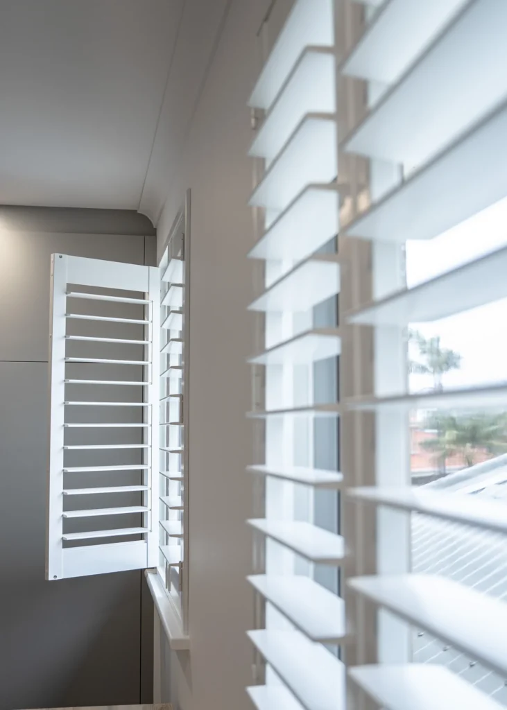 White PVC plantation shutters installed in a Perth home