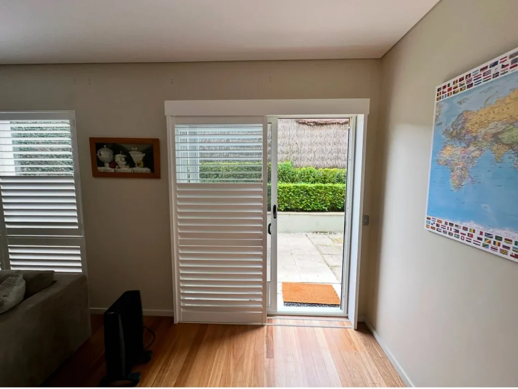 Sliding plantation shutters across a wide opening