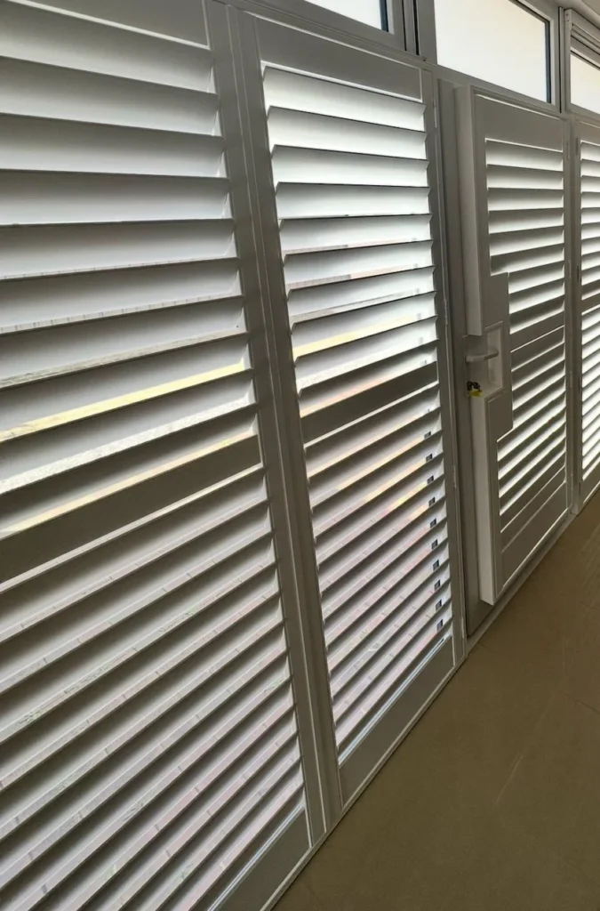 Plantation shutters made to fit a specially shaped window