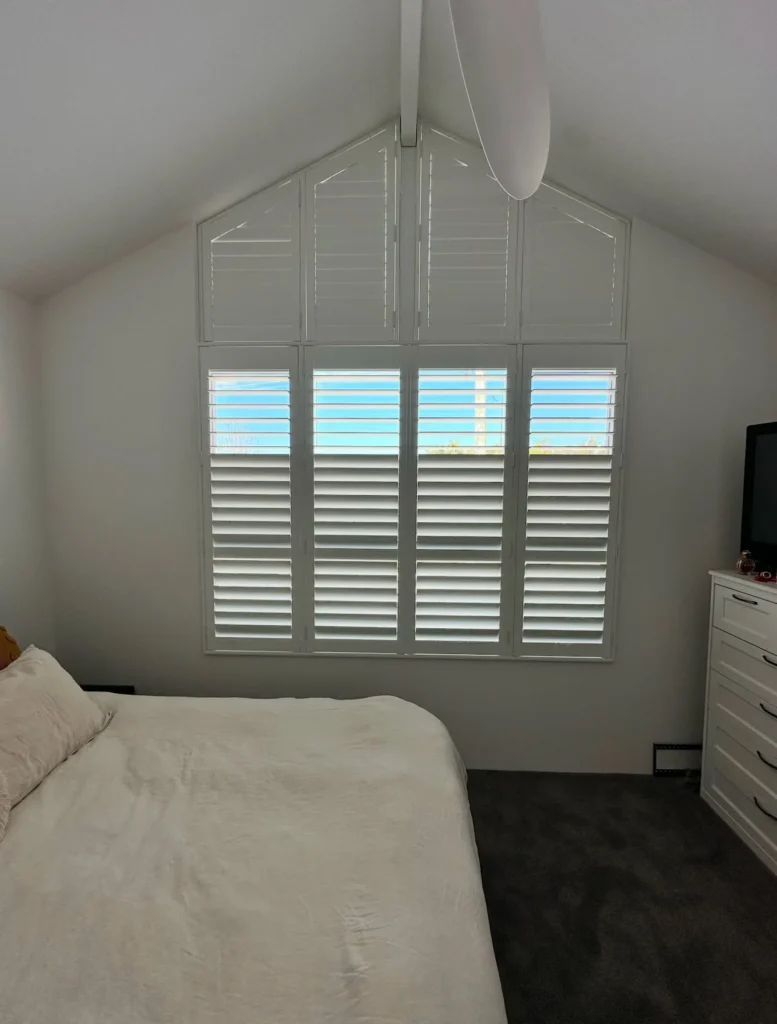 Plantation shutters made to fit a specially shaped window