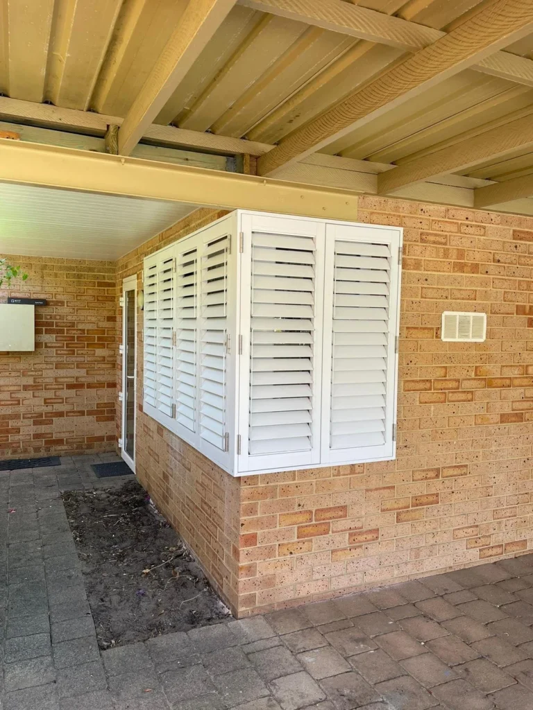External aluminium plantation shutters on an outdoor area