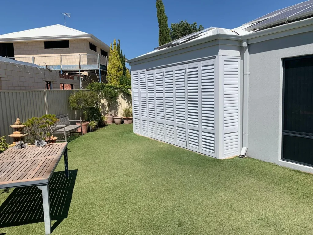 External aluminium plantation shutters on an outdoor area