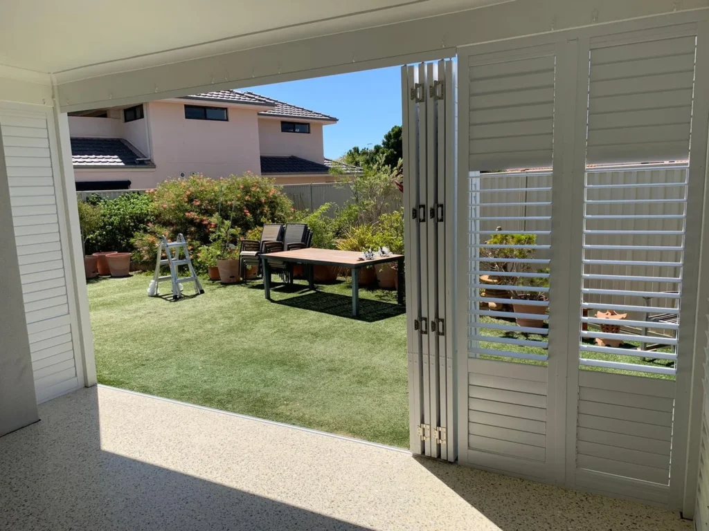 External plantation shutters enclosing a patio