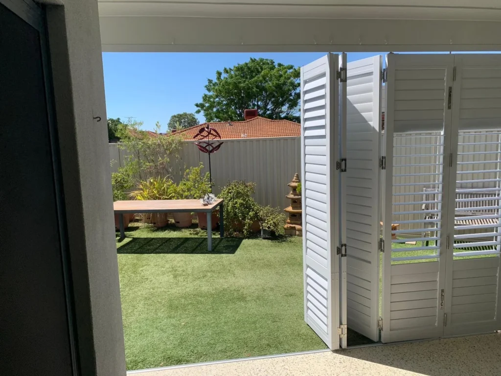 External aluminium plantation shutters on an outdoor area