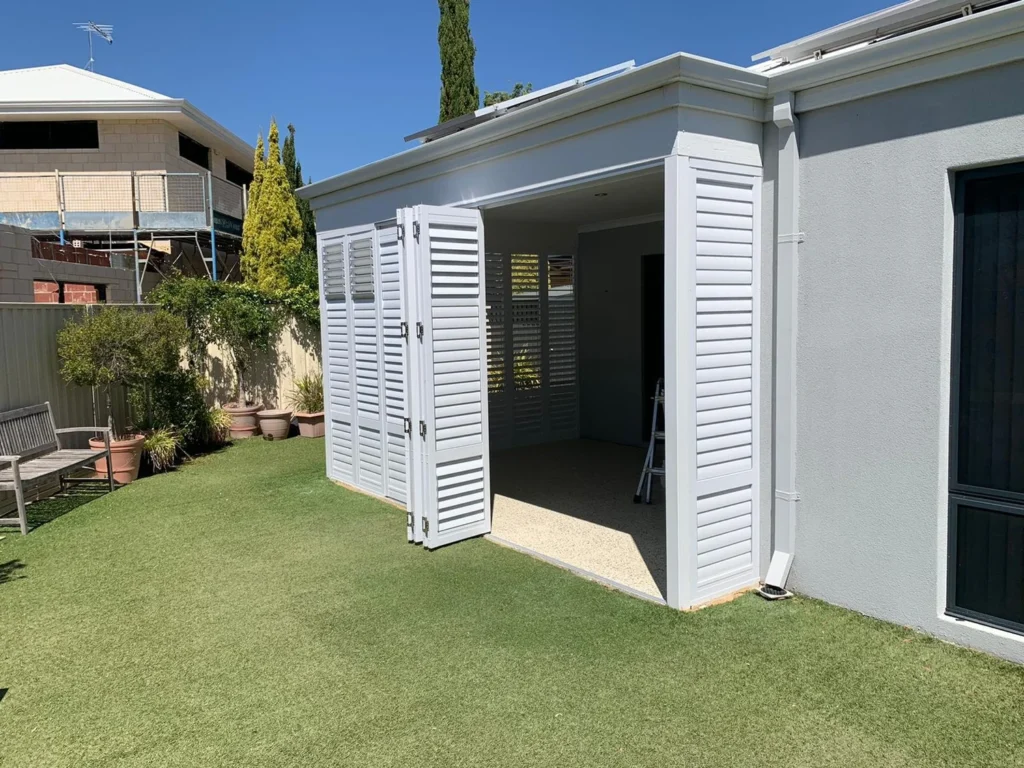 External aluminium plantation shutters on an outdoor area