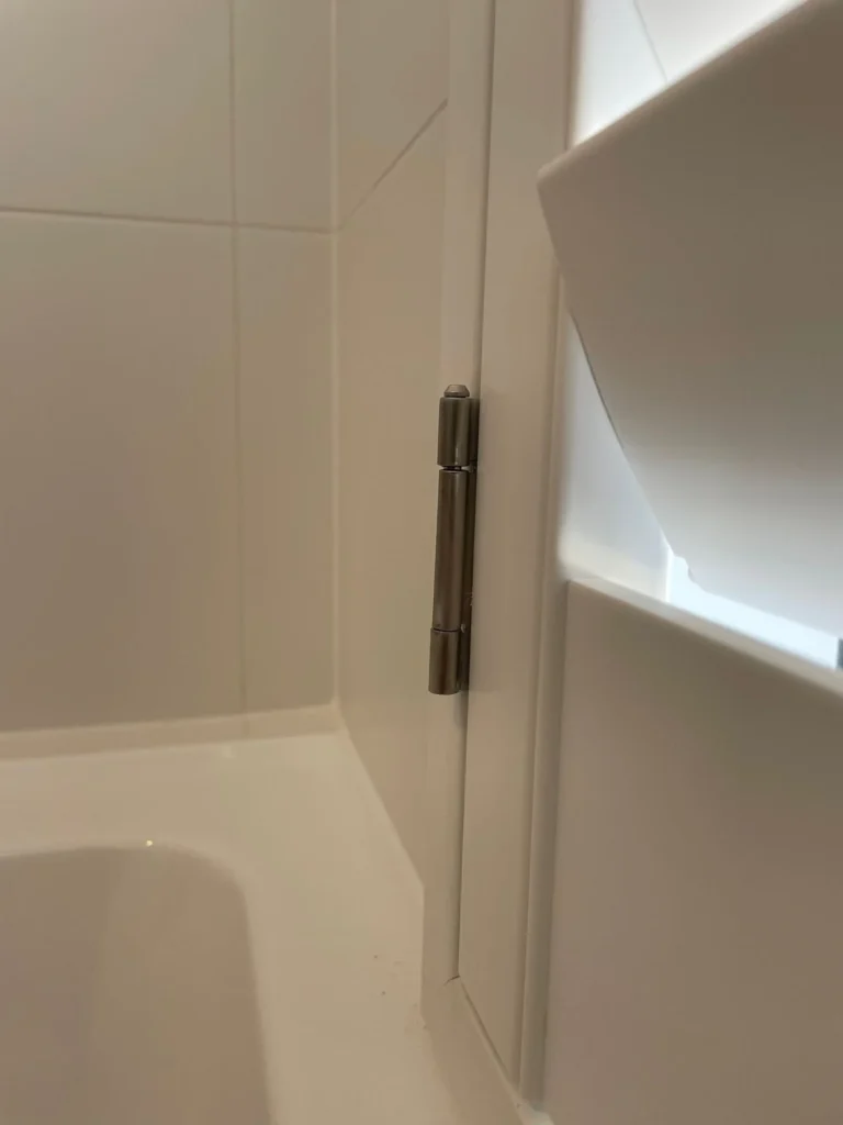 Moisture-resistant plantation shutters in a wet area