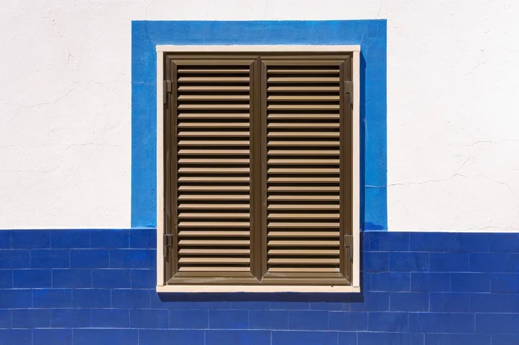 Closed window shutters on a Mediterranean house