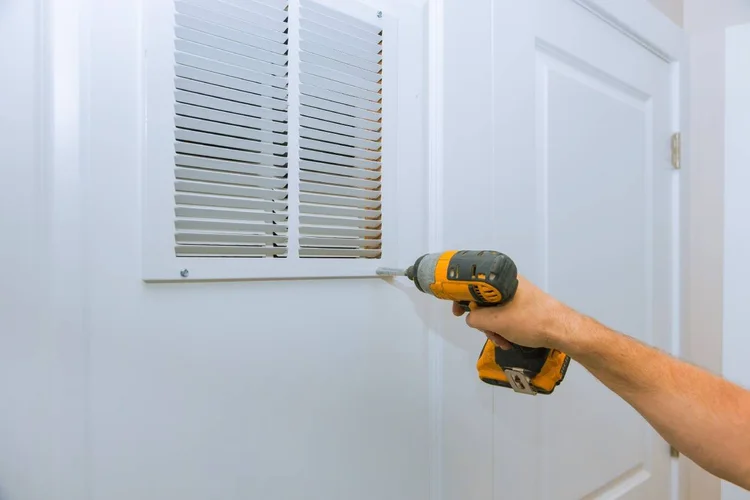 Tradesman holding a drill